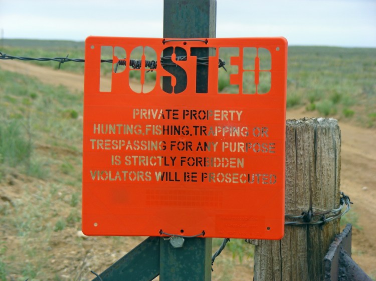 I thought this was an unusual "posted" sign...Made out of hard plastic...