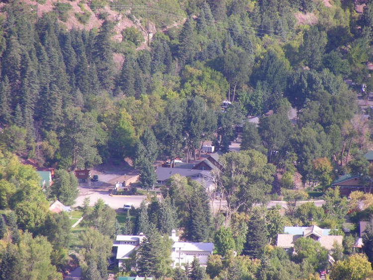 I have been waiting to post a photo of our campsite, because I always do. If you look real hard at the center of the picture you will see our little trailer that could...