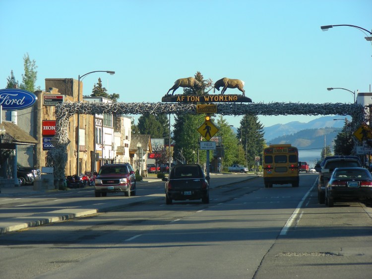We stopped in Afton Wyoming and found a laundry to get spruced up at. This is reportedly the largest elk antler arch in the world. We couldn't argue against it. I didn't plan it, but the hearse and the bus in the same shot. The cycle of life, or close... 