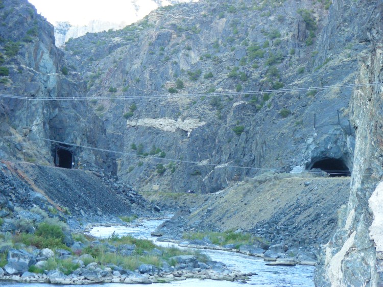 The tunnel on the right is for road traffic and the one on the left is for trains...