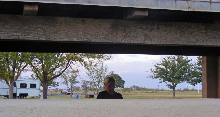 Norm enjoying doing the dishes (I cook). We walked a long ways, climbed around on a gym set, and watched some skeet shooters...